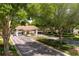 Community entrance featuring a beautiful gated entrance and landscaping at 3921 Doune Way, Clermont, FL 34711