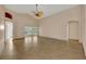 Bright living room with tile floors and access to a sunroom at 3921 Doune Way, Clermont, FL 34711