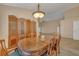 Elegant dining room with a wood table and chairs, and ornate screen at 3921 Doune Way, Clermont, FL 34711