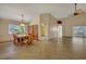 Bright dining room featuring a large table, decorative screen, and tile flooring at 3921 Doune Way, Clermont, FL 34711