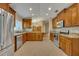 Spacious kitchen with wood cabinets and granite countertops at 3921 Doune Way, Clermont, FL 34711