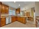 Updated kitchen with wood cabinets and granite countertops at 3921 Doune Way, Clermont, FL 34711