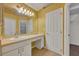 Bathroom with vanity, sink, and walk-in closet at 3921 Doune Way, Clermont, FL 34711