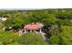 Gated community entrance with lush landscaping and palm trees at 3921 Doune Way, Clermont, FL 34711