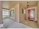 Covered front porch with red door entry at 3921 Doune Way, Clermont, FL 34711