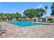 Inviting community pool with lounge chairs and shaded areas at 3921 Doune Way, Clermont, FL 34711