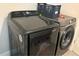 Convenient laundry room with modern Samsung washer and dryer at 2524 Good Homes Rd, Orlando, FL 32818