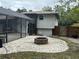 Relaxing patio with fire pit near pool at 2524 Good Homes Rd, Orlando, FL 32818