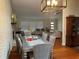 Bright dining room with seating for six and views to living room at 2524 Good Homes Rd, Orlando, FL 32818