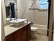 Clean bathroom with tub shower combination and updated vanity at 2524 Good Homes Rd, Orlando, FL 32818