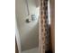 Clean shower with tile surround and shower curtain at 2524 Good Homes Rd, Orlando, FL 32818