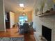 Bright dining room with hardwood floors and fireplace at 2524 Good Homes Rd, Orlando, FL 32818