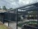 Screened pool area with patio and fire pit at 2524 Good Homes Rd, Orlando, FL 32818