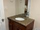 Updated bathroom with granite vanity and a modern sink at 2524 Good Homes Rd, Orlando, FL 32818