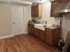 Efficient kitchen featuring a farmhouse sink and ample cabinetry at 2524 Good Homes Rd, Orlando, FL 32818