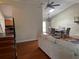 Living room features hardwood floors and a view of dining area at 2524 Good Homes Rd, Orlando, FL 32818