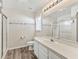 Clean bathroom with a shower/tub combo, vanity, and updated fixtures at 533 Grand Vista Trl, Leesburg, FL 34748
