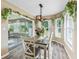 Bright dining area with a glass-top table and large windows at 533 Grand Vista Trl, Leesburg, FL 34748