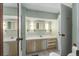 Double vanity bathroom with mirror and toilet at 512 Palo Verde Dr, Leesburg, FL 34748