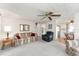 Living room features view into kitchen and dining areas at 512 Palo Verde Dr, Leesburg, FL 34748