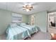 Bedroom with twin beds and view of living room at 512 Palo Verde Dr, Leesburg, FL 34748