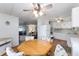 Open dining area with kitchen and living room access at 512 Palo Verde Dr, Leesburg, FL 34748