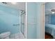 Bathroom with shower, toilet, and grab bar at 512 Palo Verde Dr, Leesburg, FL 34748