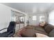 Sunroom with sliding glass doors offering views of the living room and backyard at 512 Palo Verde Dr, Leesburg, FL 34748