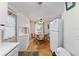 Bright kitchen with white appliances and wood flooring at 512 Palo Verde Dr, Leesburg, FL 34748