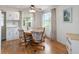 Cozy dining area with round table and four chairs at 512 Palo Verde Dr, Leesburg, FL 34748