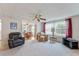 Comfortable living room with plush seating and view to dining area at 512 Palo Verde Dr, Leesburg, FL 34748