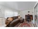Bright sunroom with a sectional sofa, workspace, and ample natural light at 512 Palo Verde Dr, Leesburg, FL 34748