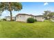 Well maintained single wide mobile home with green lawn at 512 Palo Verde Dr, Leesburg, FL 34748