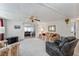 Spacious living room with comfy seating and carpet at 512 Palo Verde Dr, Leesburg, FL 34748