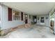 Covered patio with concrete flooring and storage area at 512 Palo Verde Dr, Leesburg, FL 34748