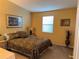 Cozy bedroom with mirrored closet and neutral decor at 1150 Paradise Dr, The Villages, FL 32159