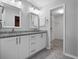 Bright bathroom featuring double sinks and granite countertops at 21821 Prince William Ct, Leesburg, FL 34748