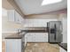 Bright kitchen featuring granite countertops and white cabinetry at 21821 Prince William Ct, Leesburg, FL 34748