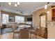 Living room with hardwood floors, large windows, and comfortable seating area at 27303 Gingerbread Pl, Leesburg, FL 34748