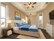 Main bedroom with a bed, wood-look floors, and large windows at 27303 Gingerbread Pl, Leesburg, FL 34748