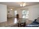 Living room with tile flooring, sliding doors to a screened porch, and comfortable seating at 3680 Doune Way, Clermont, FL 34711