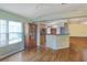 Open dining area with hardwood floors and built-in shelving at 875 Delfino Pl, Lake Mary, FL 32746