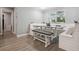 Built-in breakfast nook with bench seating and a farmhouse table at 1136 Brick Rd, Winter Garden, FL 34787