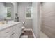Bathroom with a walk-in shower and modern vanity at 1136 Brick Rd, Winter Garden, FL 34787