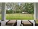 View of a fenced backyard with lush greenery and a shed at 1136 Brick Rd, Winter Garden, FL 34787