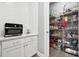 Walk-in pantry with ample shelving for storage at 1136 Brick Rd, Winter Garden, FL 34787