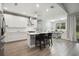 Modern kitchen with white cabinets and island at 1136 Brick Rd, Winter Garden, FL 34787