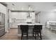 Modern kitchen with white cabinets and island at 1136 Brick Rd, Winter Garden, FL 34787