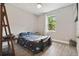 Bedroom with a full-size bed, window, and wood-look floors at 1136 Brick Rd, Winter Garden, FL 34787
