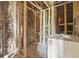 Unfinished bathroom with plumbing and framing at 1136 Brick Rd, Winter Garden, FL 34787